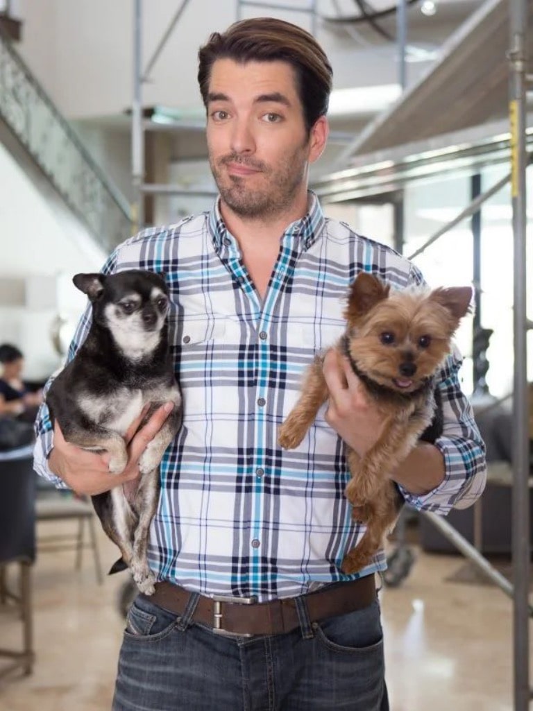 Jonathan Scott with his two puppies